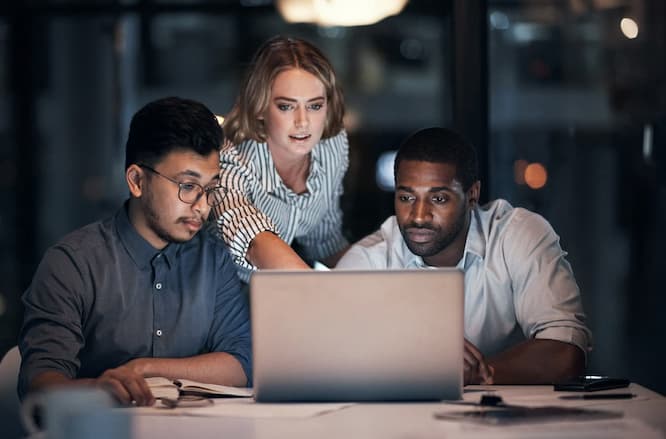 team at a laptop